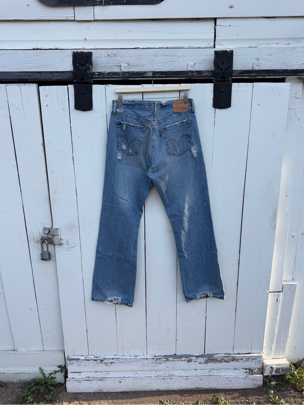 Levi's Medium Blue Bootcut Jeans with Distressed Hem